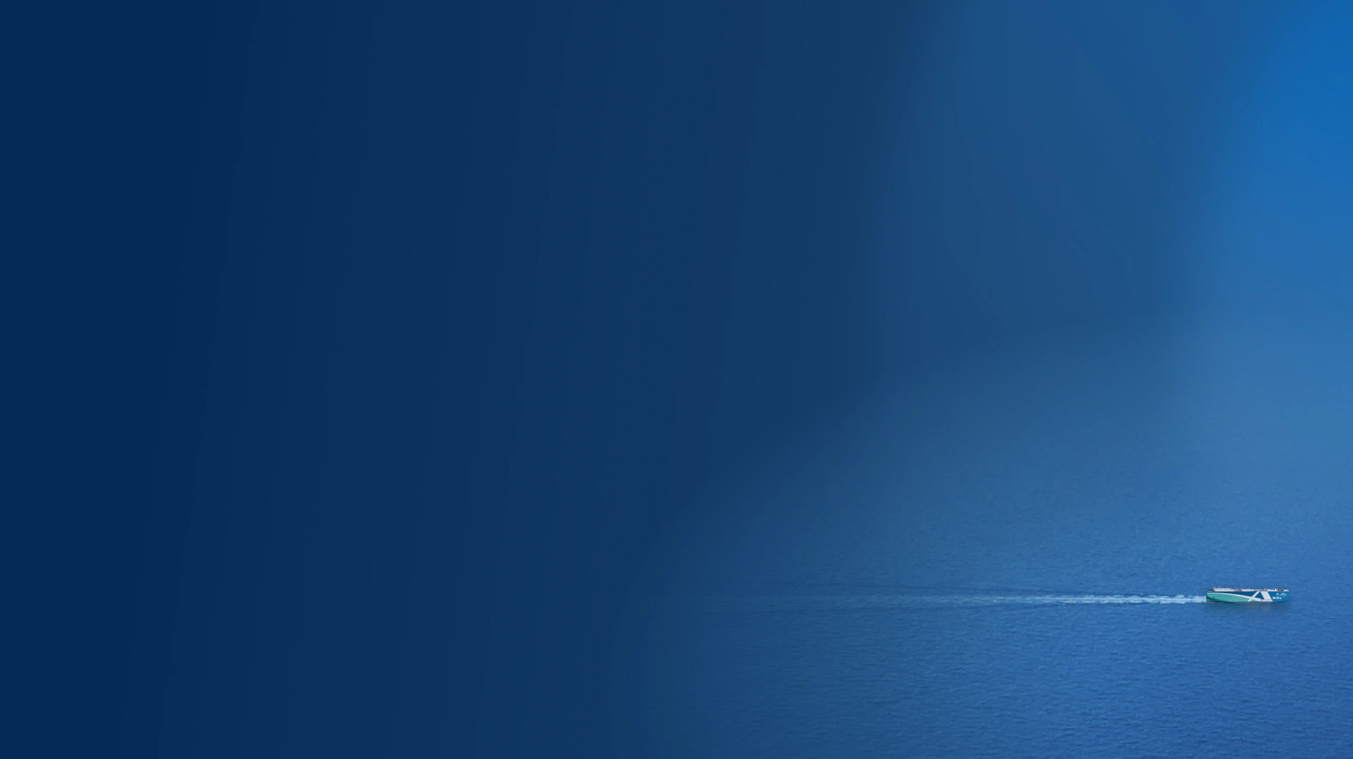 A small boat with a white wake trails across a vast, calm blue sea under a clear sky, evoking a sense of solitude and tranquility.